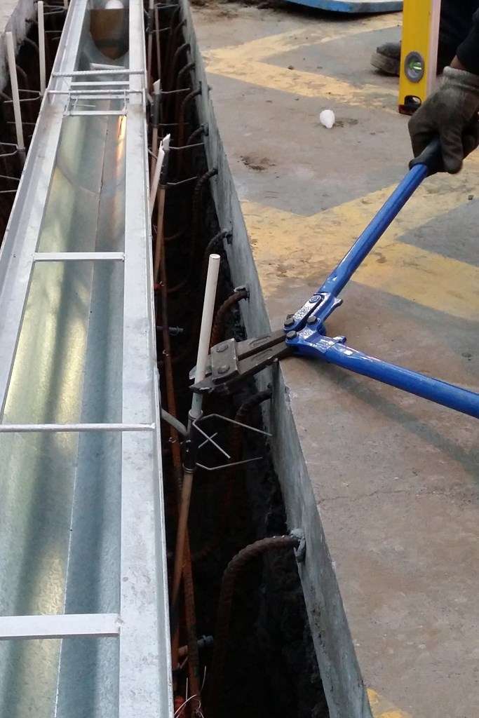 The Fibreglass rods are trimmed to below the surface